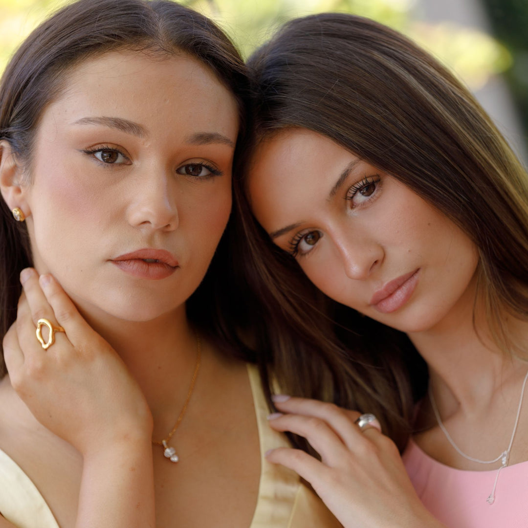 Two models wearing THOMAS SABO yellow gold and silver jewellery