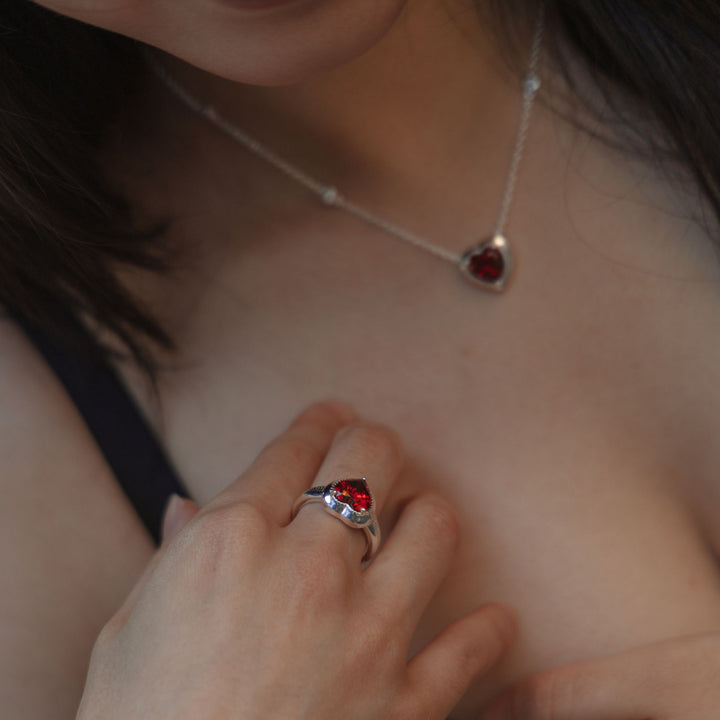 Model wearing THOMAS SABO silver heart jewellery with red stone