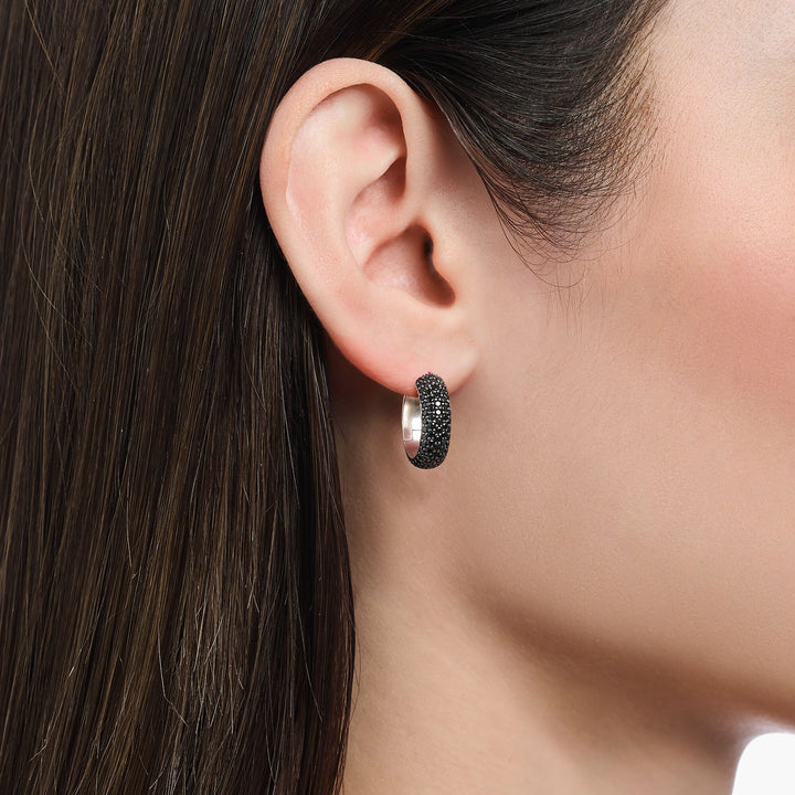 Small, wide hoop earrings with black zirconia