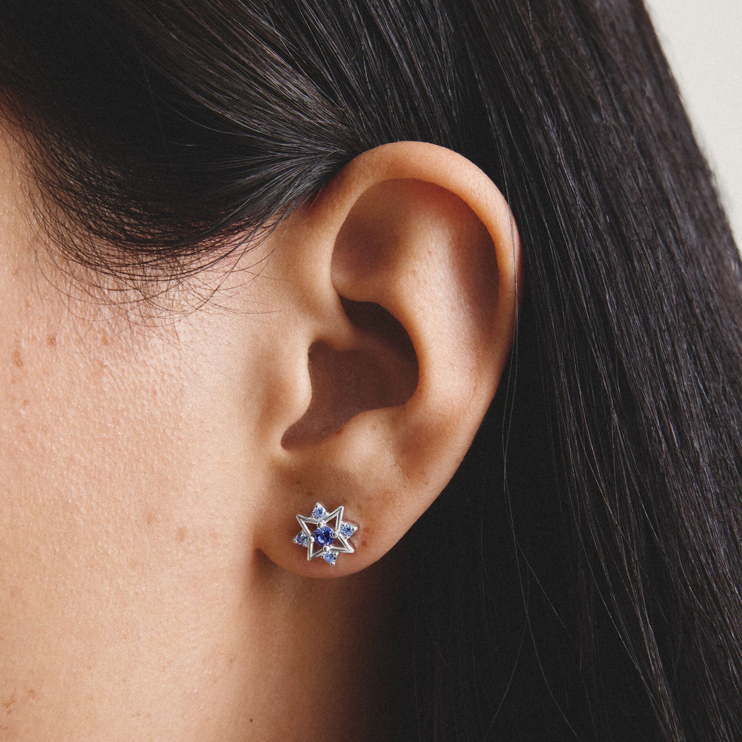 Stud earrings star with blue stones