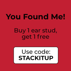 Single Cross hoop earring with ruby red stones