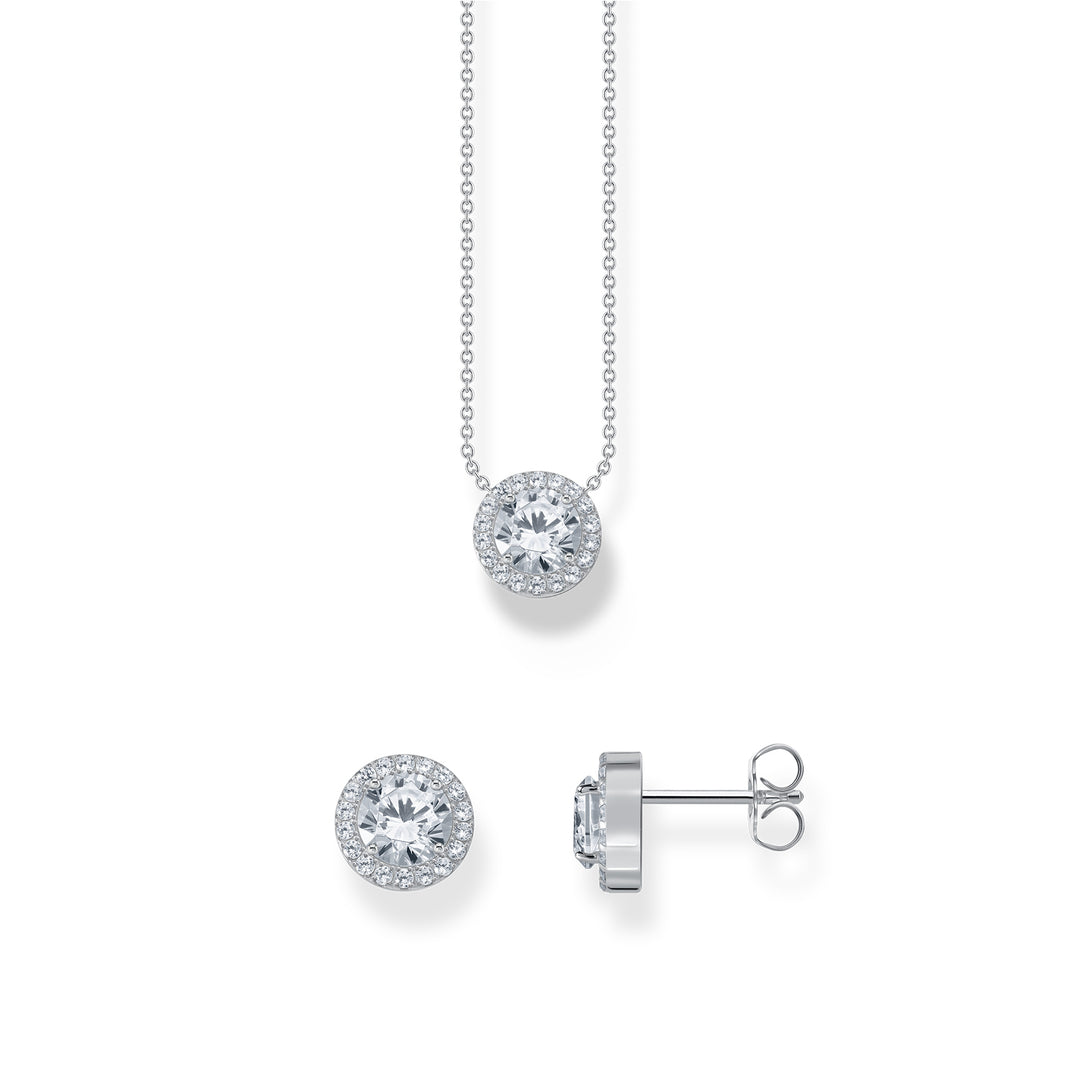 Gold-plated star bracelet and mismatched moon and star drop earrings with white stones from THOMAS SABO.