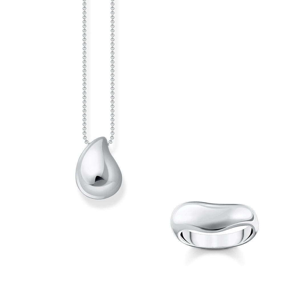 Gold-plated star bracelet and mismatched moon and star drop earrings with white stones from THOMAS SABO.