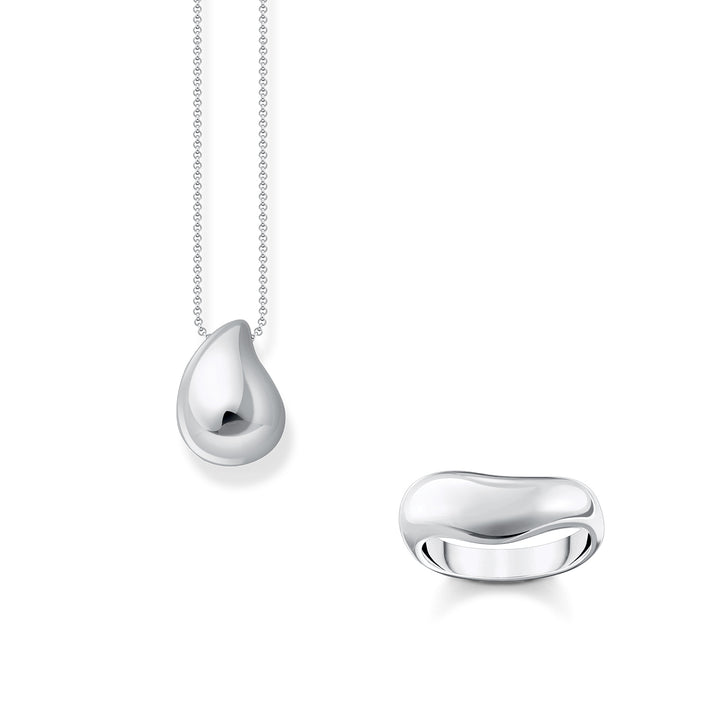 Gold-plated star bracelet and mismatched moon and star drop earrings with white stones from THOMAS SABO.