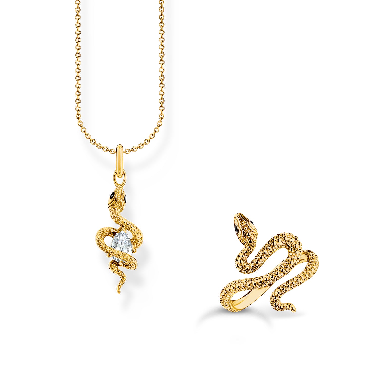Gold-plated star bracelet and mismatched moon and star drop earrings with white stones from THOMAS SABO.